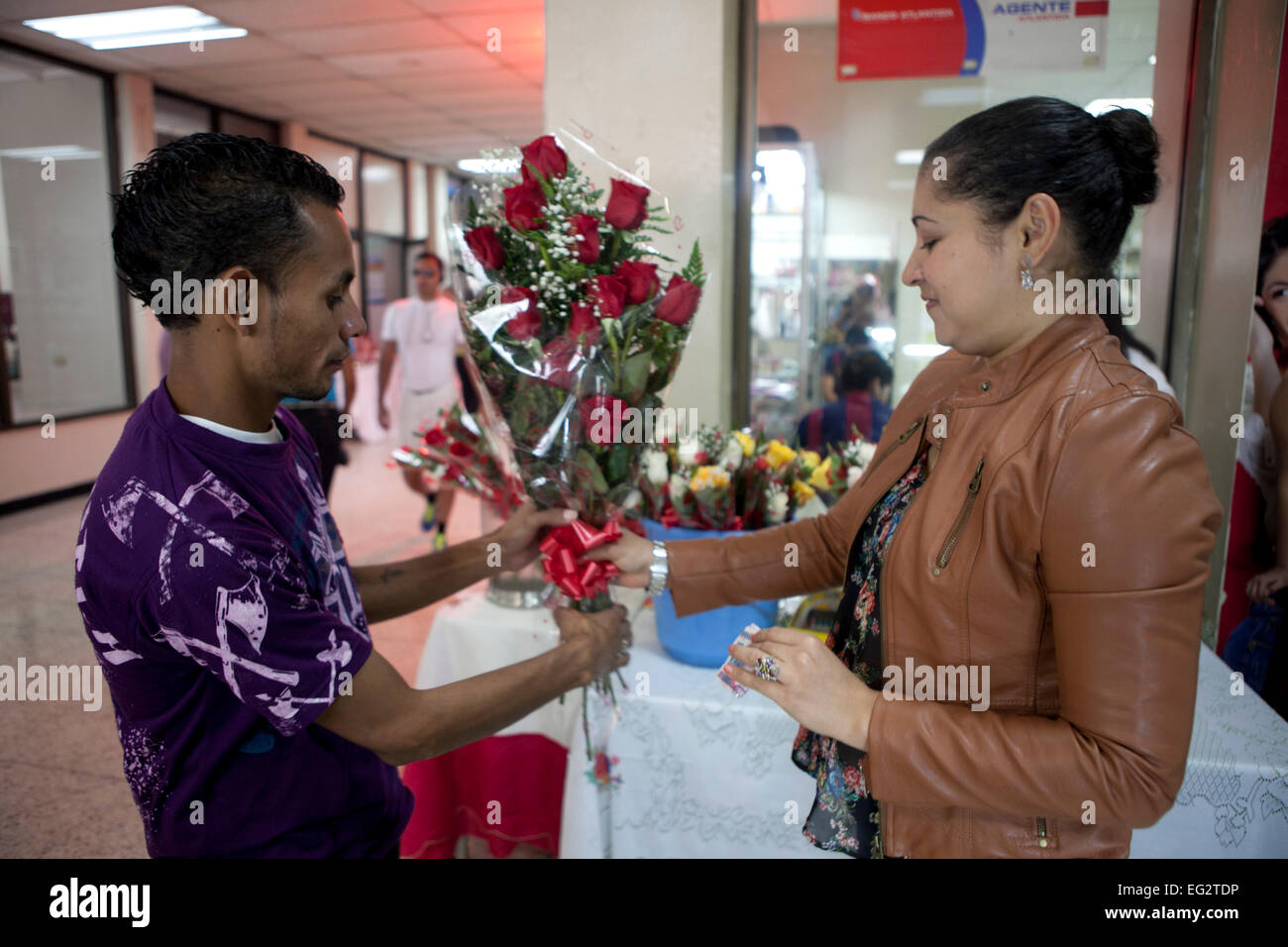 Tegucigalpa. 14th Feb, 2015. A person buys flowers in the city of