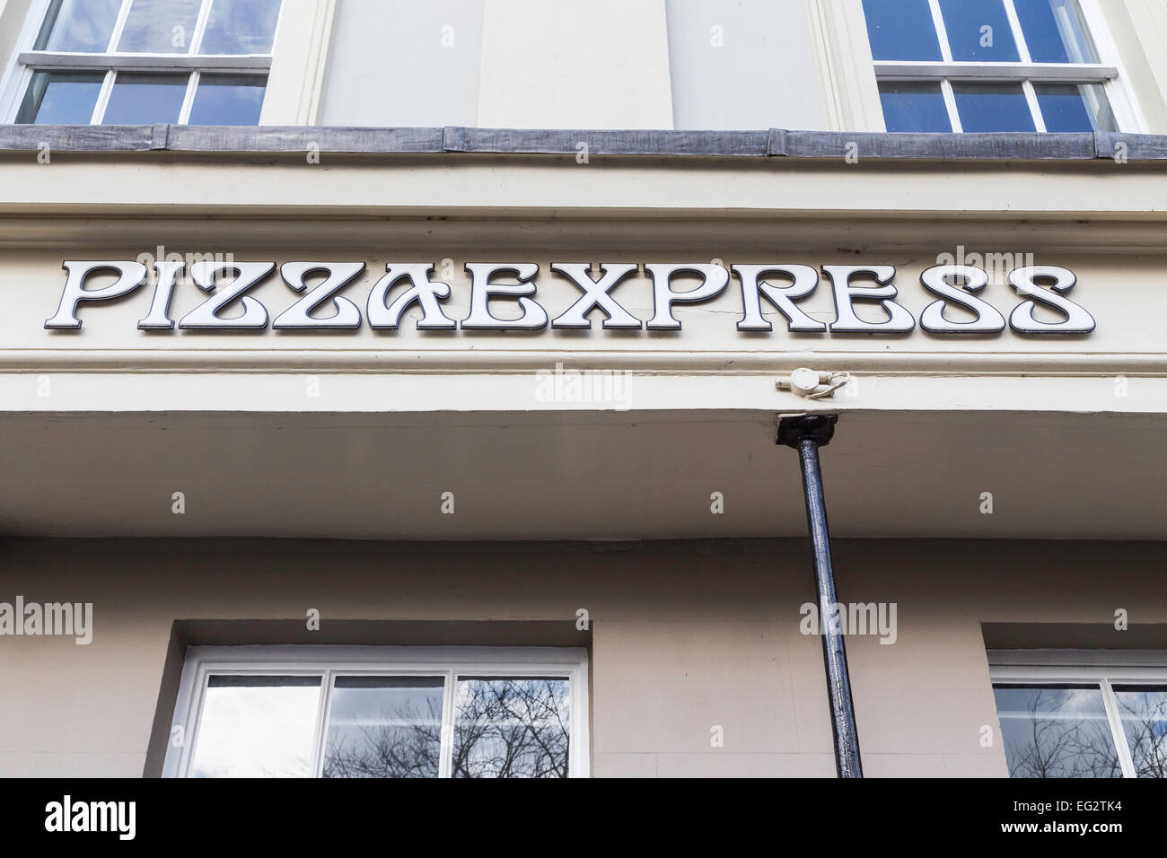 Pizza Express restaurant sign with parts of windows in the photo. Stock Photo