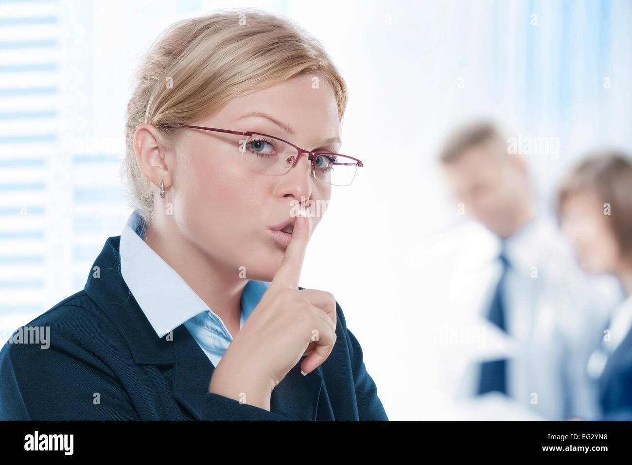 Portrait of young beautiful woman in office environment Stock Photo