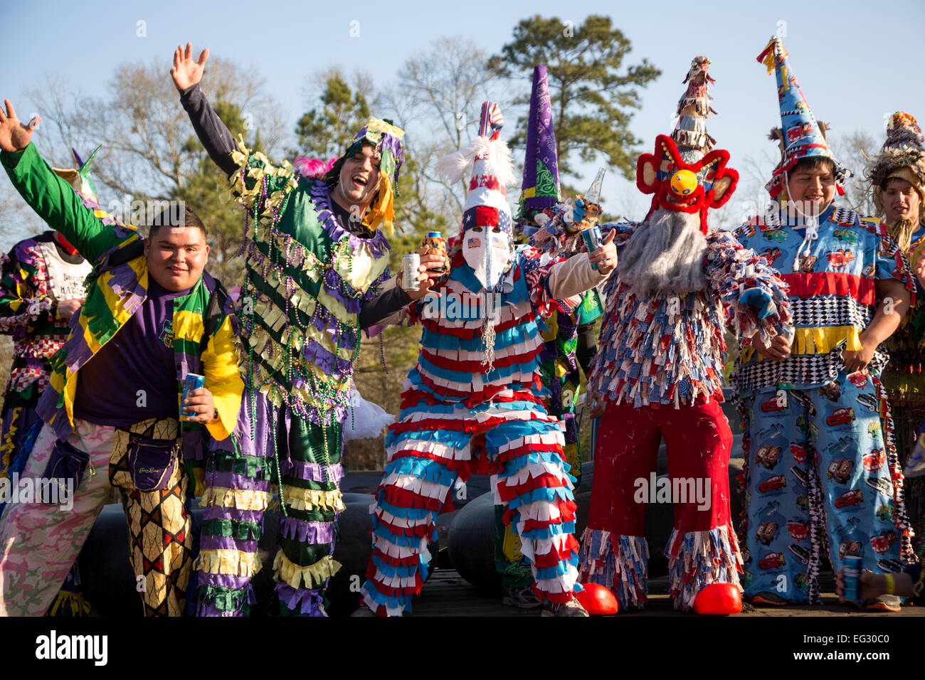 Wearing traditional Cajun Mardi Gras costume and mask participants make their way through the Coushatta Reservation at the start of the Courir de Mardi Gras February 14, 2015 in Elton, Louisiana. Revelers