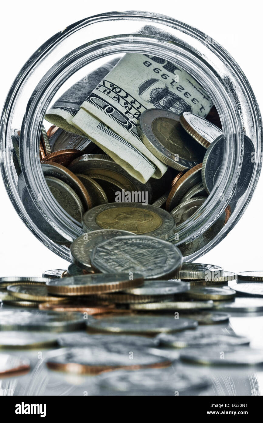 Close up view of container filled with coins on white back Stock Photo ...