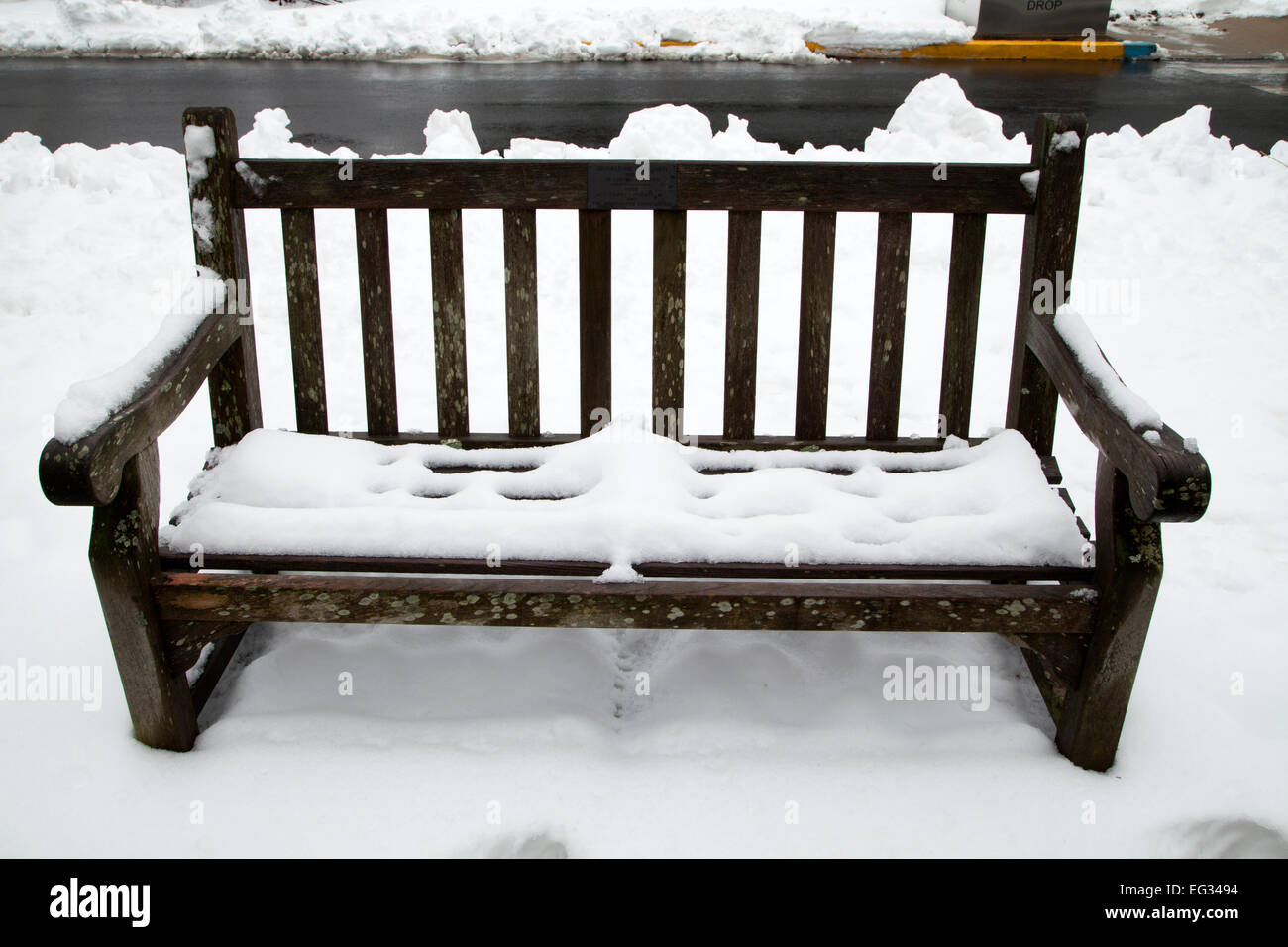 Empty bench covered with snow Stock Photo - Alamy