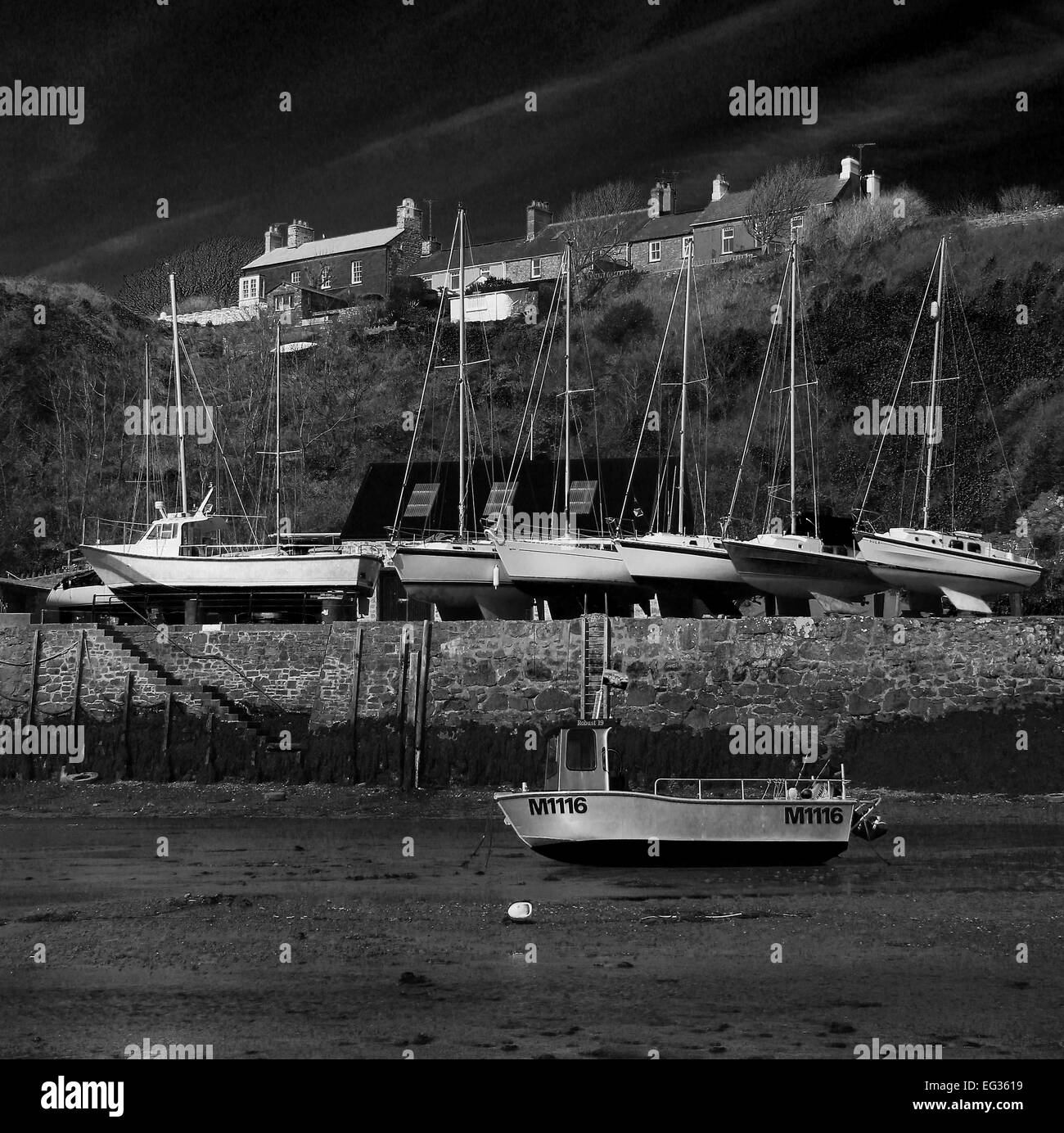 'All Moored Up' Boats on harbour wall in Solva Pembrokeshire Stock Photo