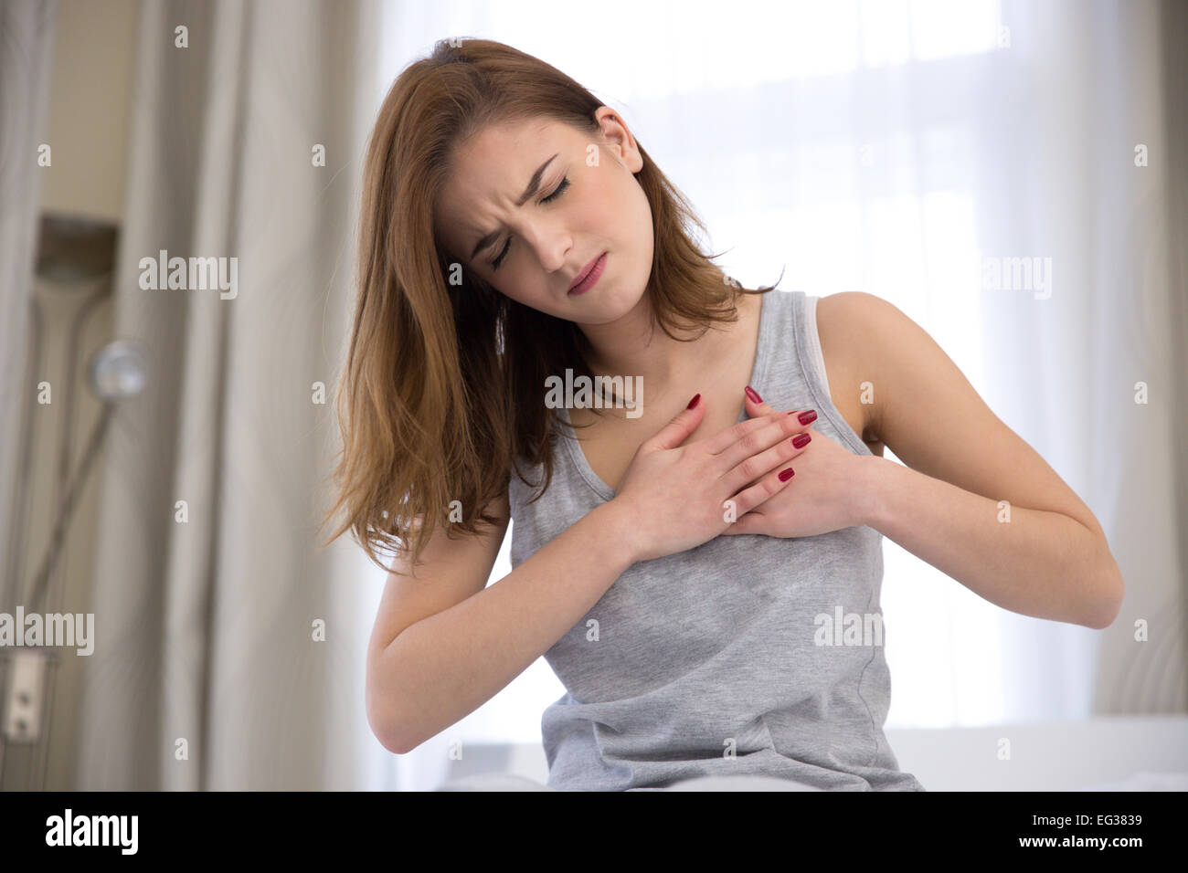 Woman chest pain hi-res stock photography and images - Page 3 - Alamy
