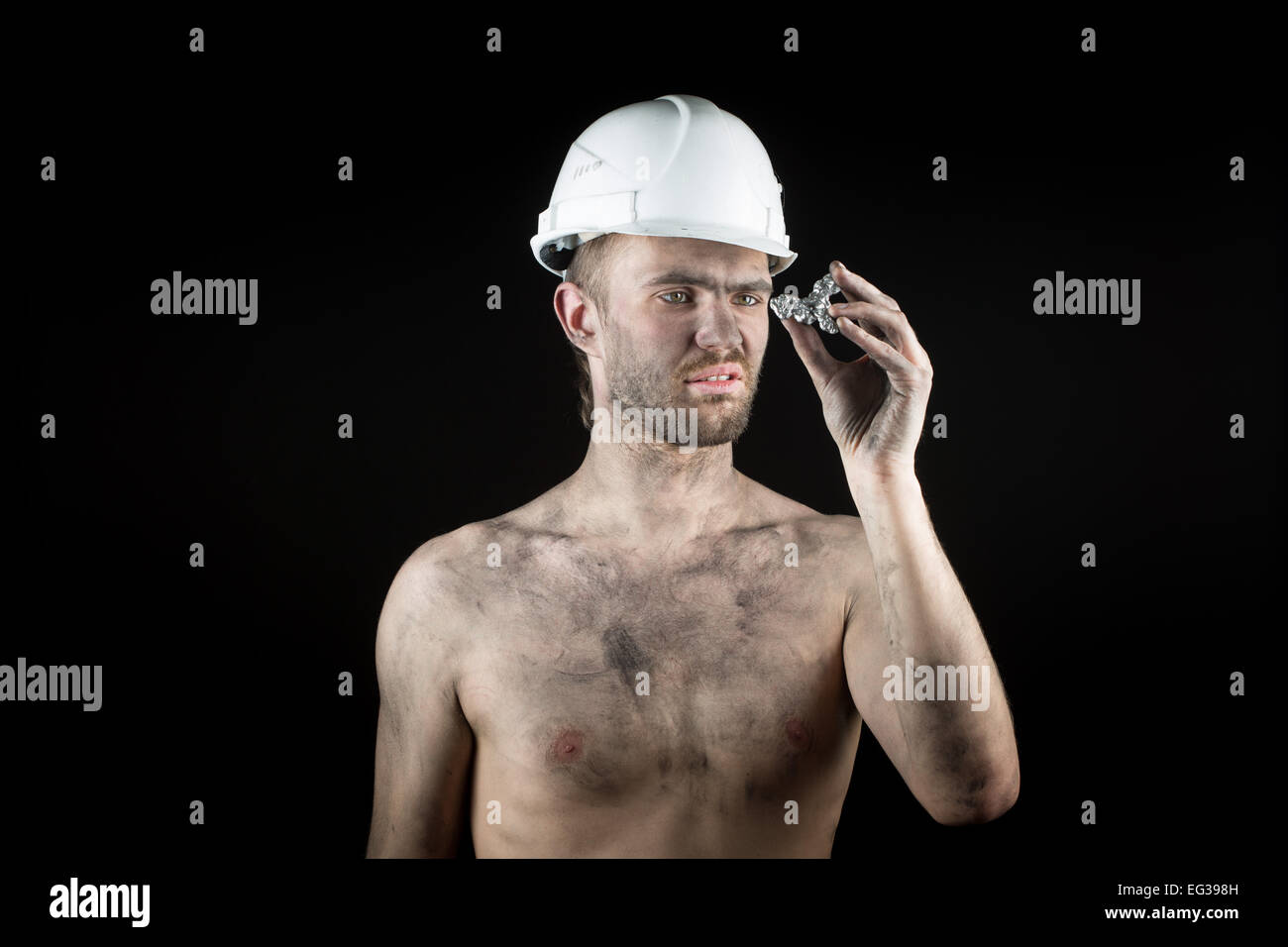 miner shows a silver nugget Stock Photo