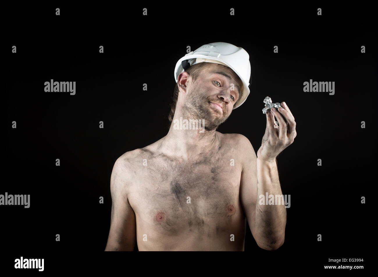 miner shows a silver nugget Stock Photo