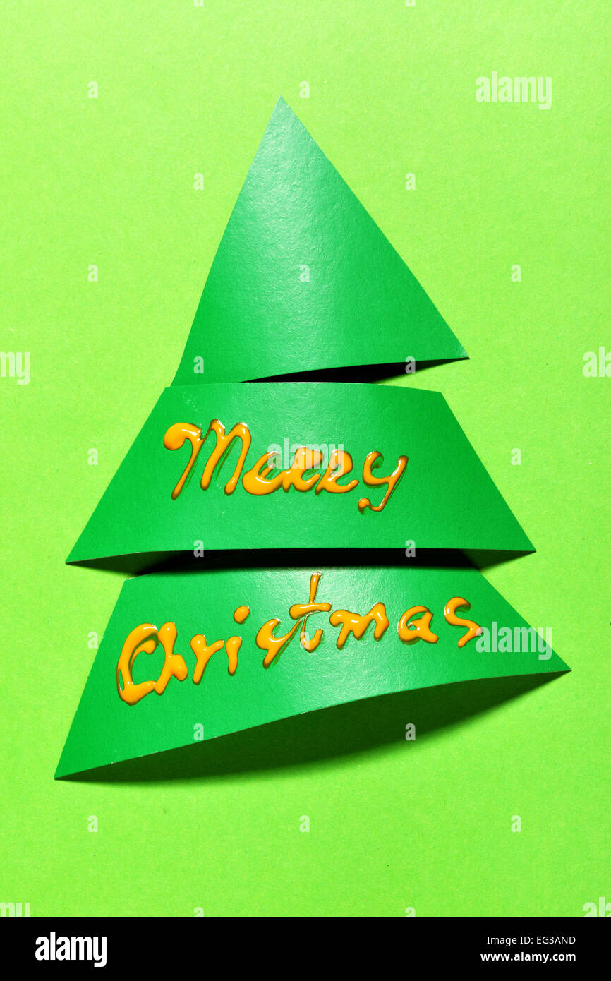 Green paper Christmas tree and wishes Stock Photo - Alamy