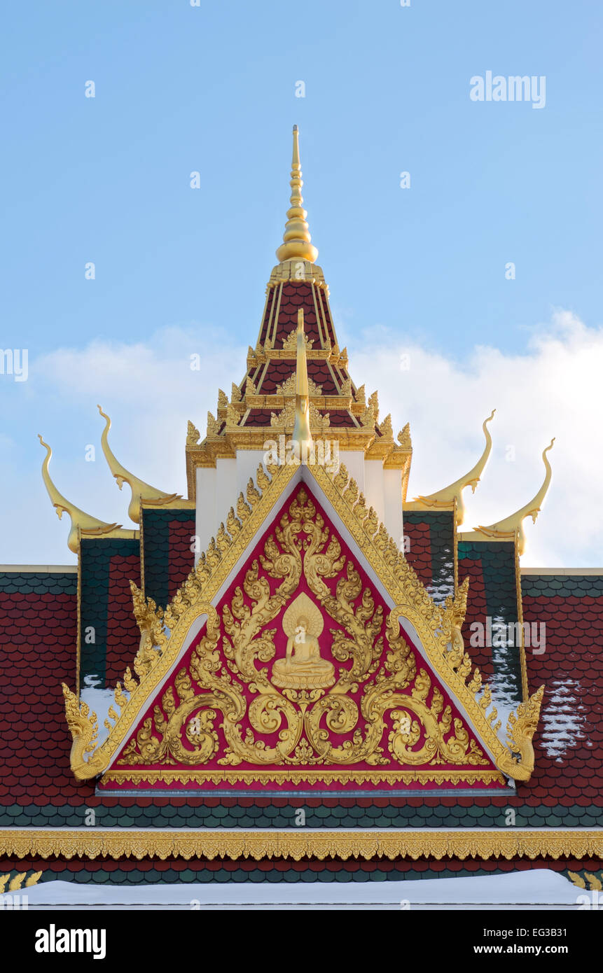 Ornate gilded rooftop and spire of buddhist monastery Stock Photo