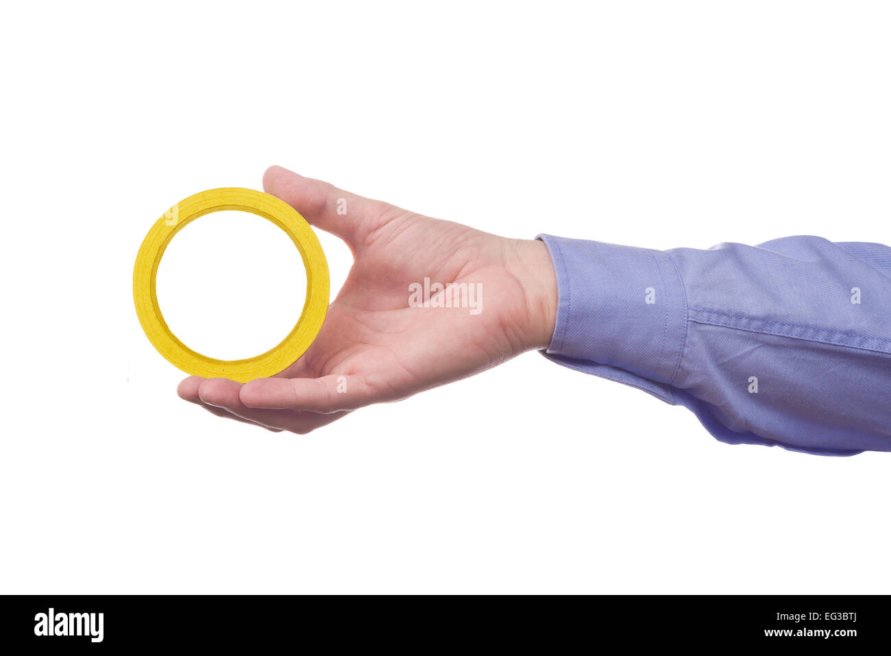 Male worker's hand holding roll of sticky adhesive paper tape. Part of series set of images with DIY tools for home job Stock Photo