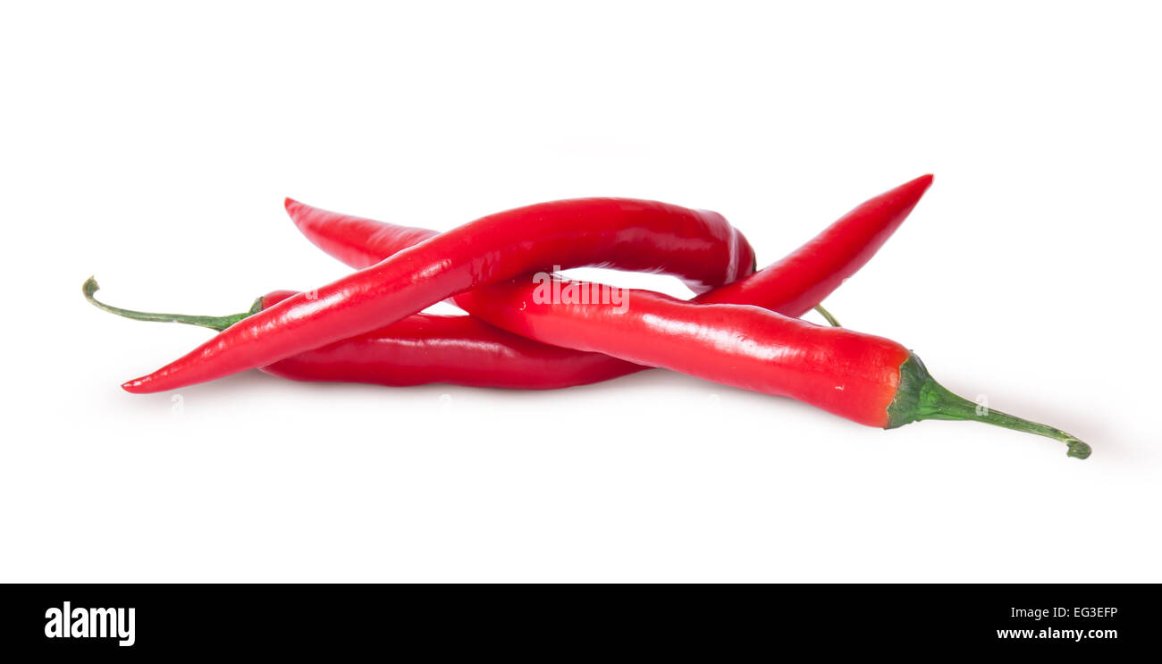Pile of three red chili peppers isolated on white background Stock Photo