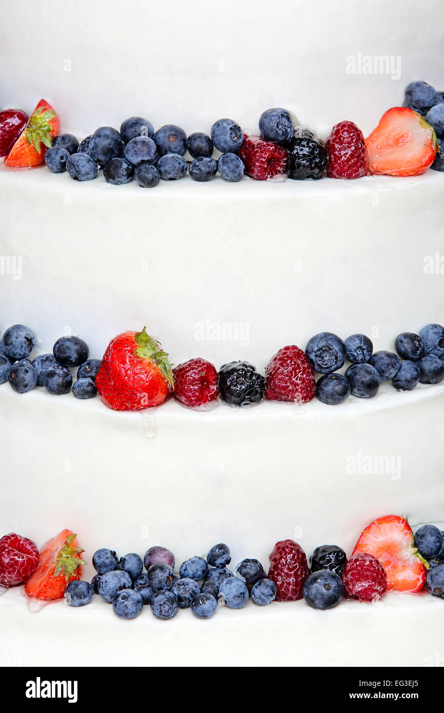 Wedding cake with fruits on white background Stock Photo