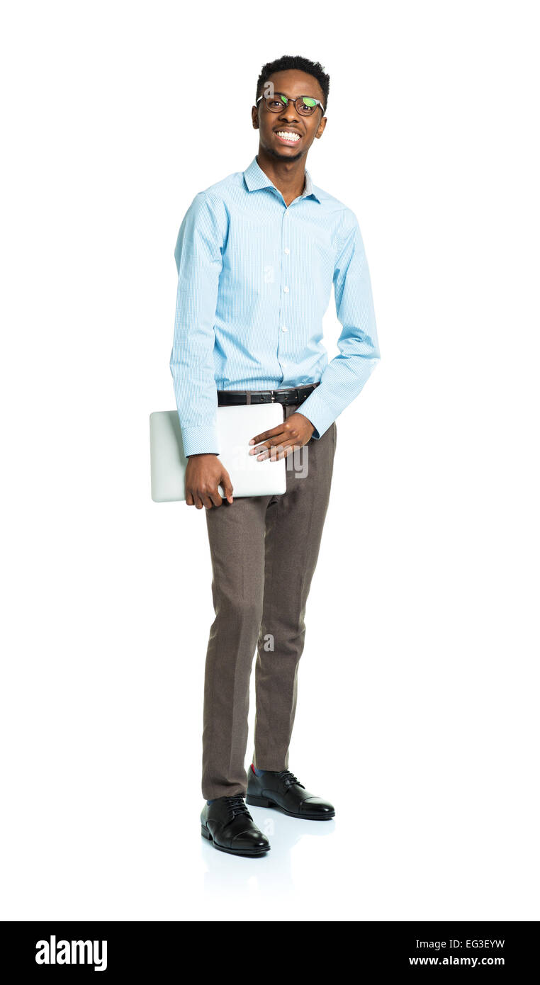 Happy african american college student standing with laptop on white background Stock Photo