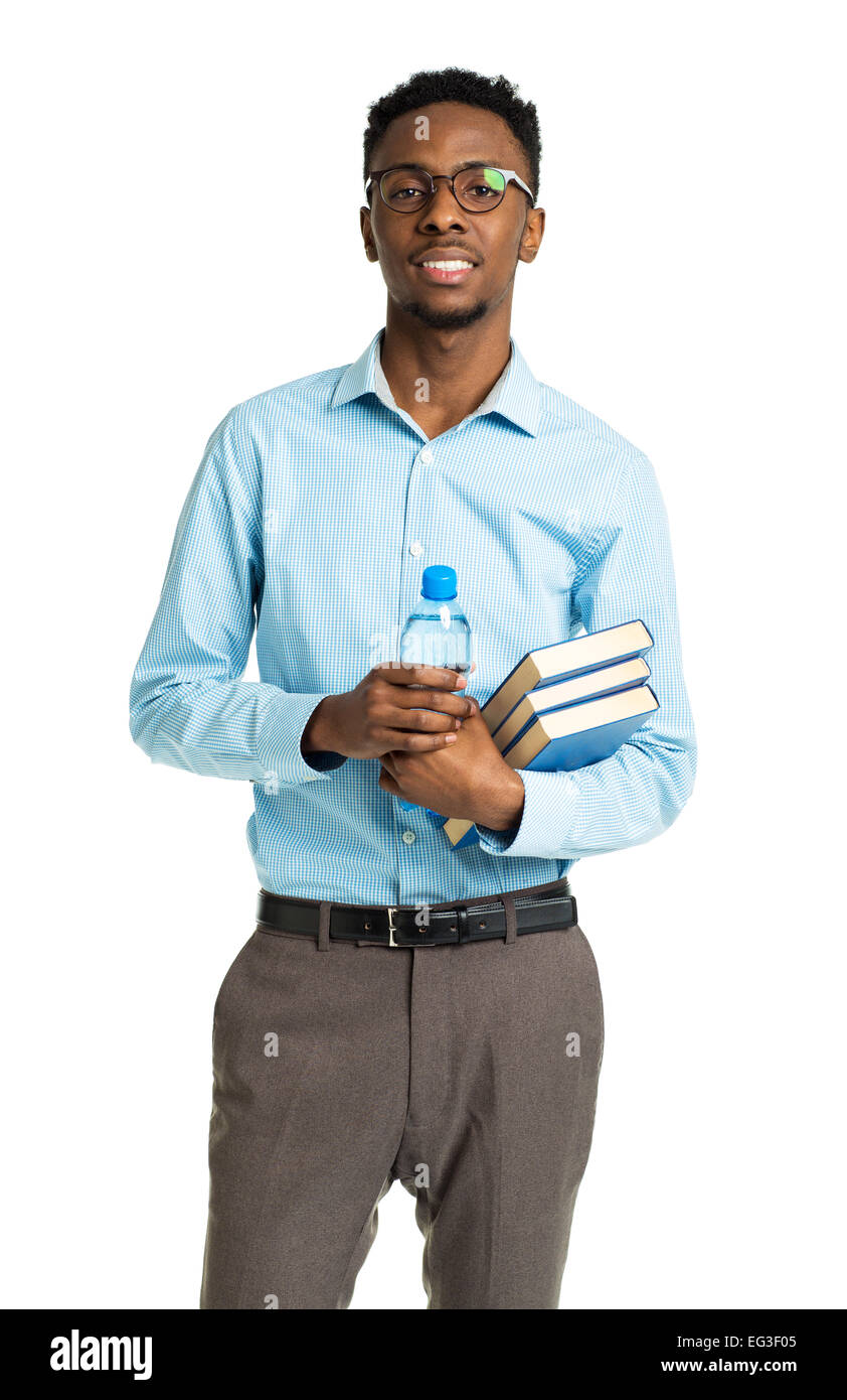 Happy african american college student standing with books in his hands on white background Stock Photo