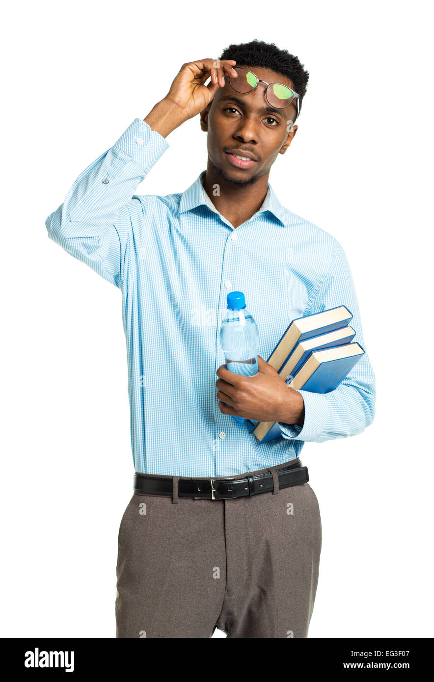 Happy african american college student standing with books in his hands on white background Stock Photo