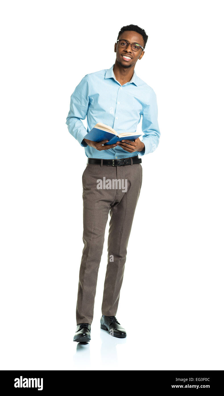 Happy african american college student standing with book in his hands on white background Stock Photo