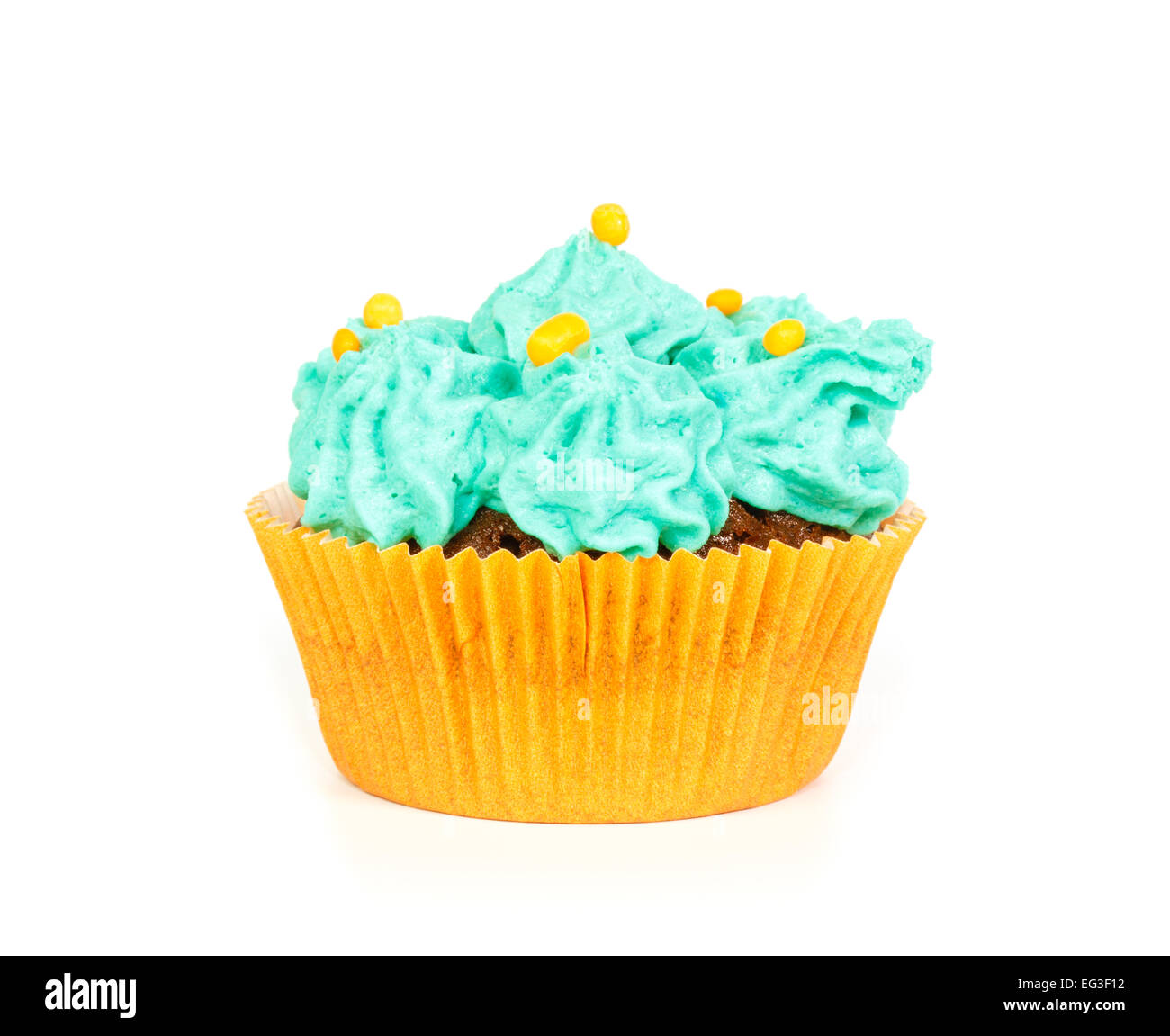 Cupcake with blue rosettes of cream frosting against white background Stock Photo