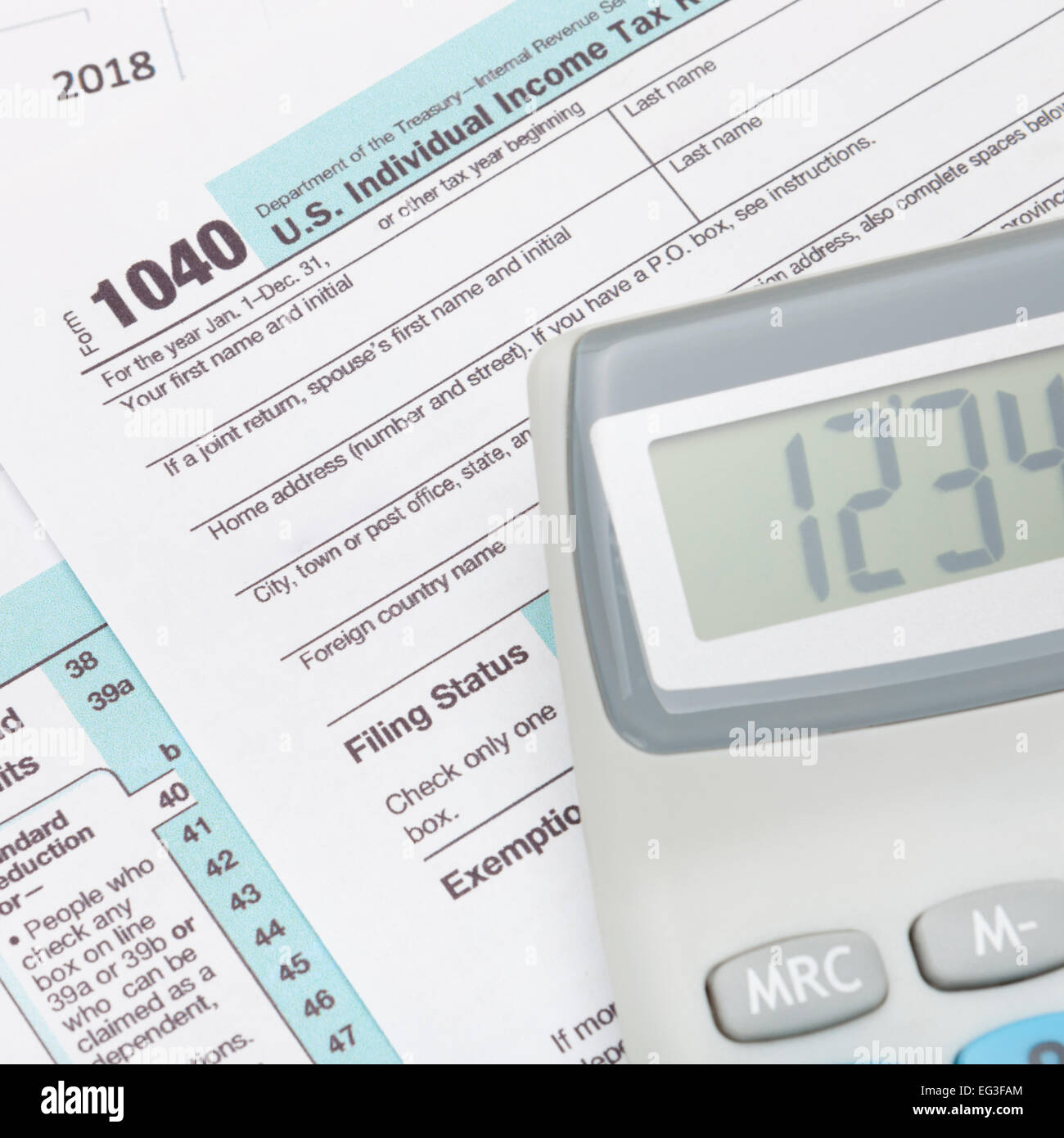 Neat calculator over US 1040 Tax Form Stock Photo Alamy