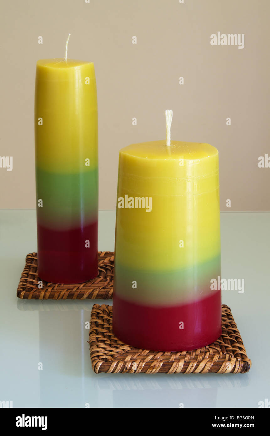 Tricolored hand made candles - craft candle series. Stock Photo