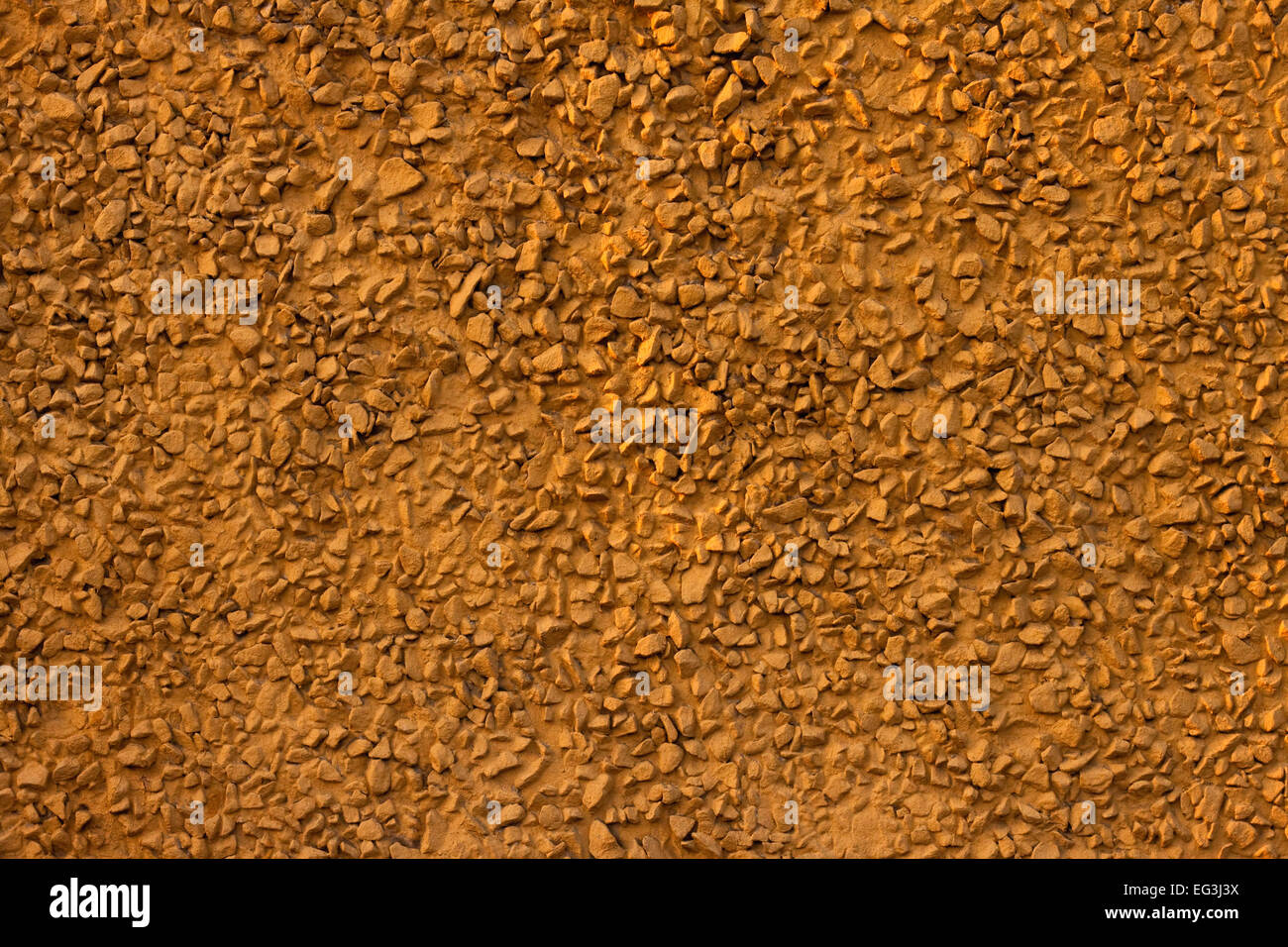Decorative yellow plaster of a wall Stock Photo