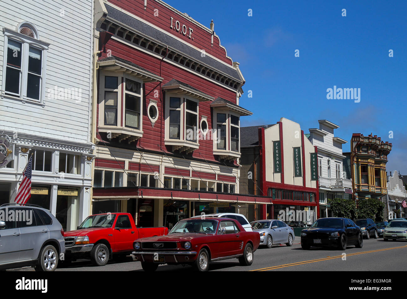 Cars drive past storefronts in Ferndale, California Stock Photo