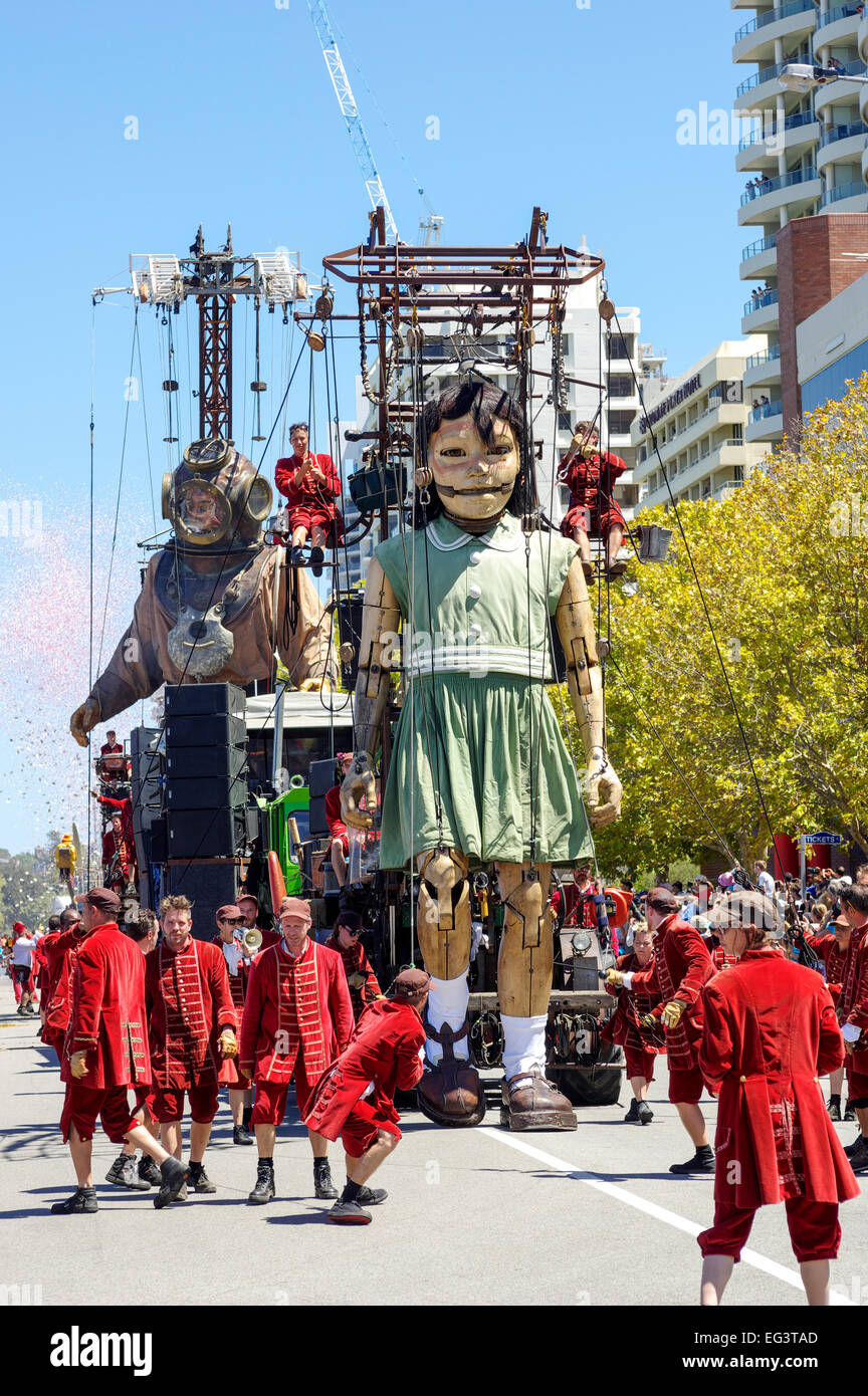 The giant diver and little girl puppets walk along Terrace Road, Perth, Western Australia. Stock Photo