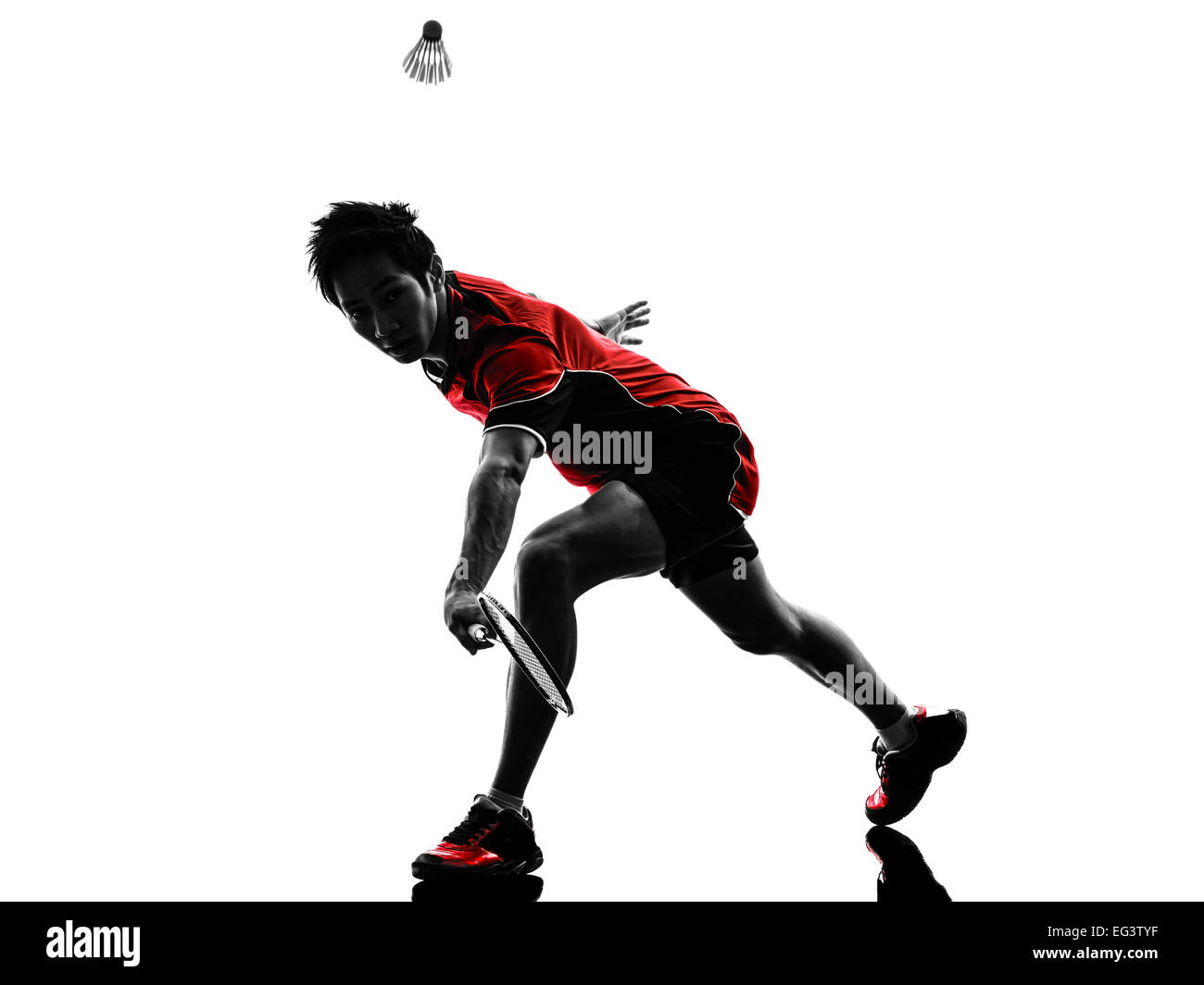 one asian badminton player young man in silhouette isolated white background Stock Photo