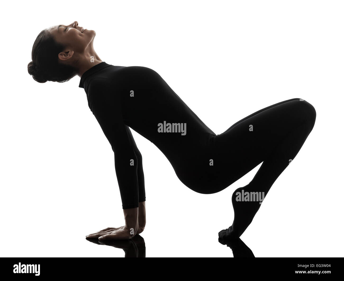 one  woman contortionist practicing gymnastic yoga in silhouette on white background Stock Photo