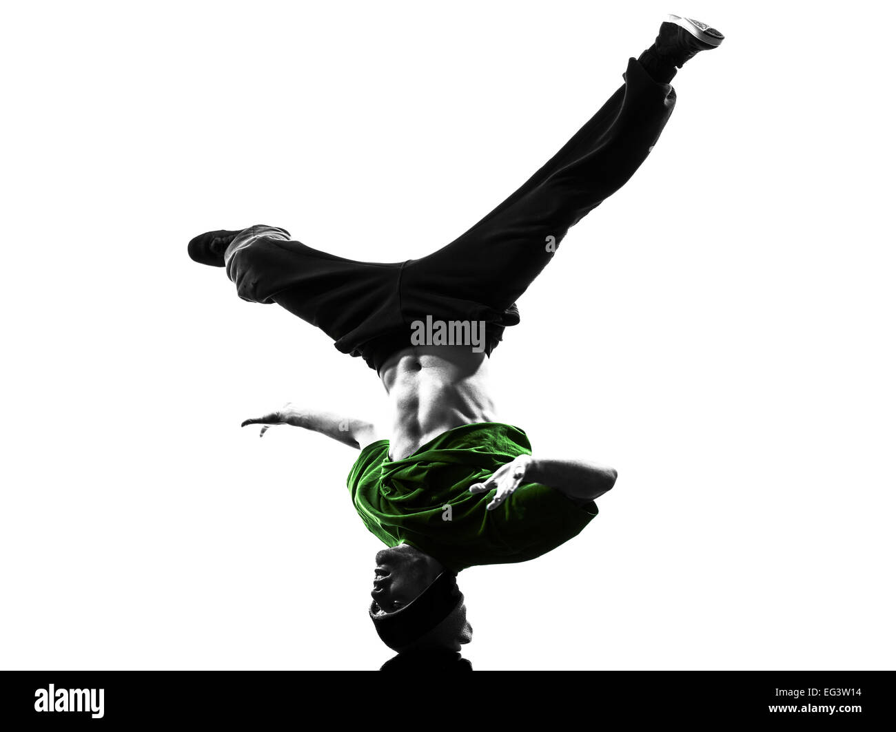 one  young acrobatic break dancer breakdancing man in silhouette white background Stock Photo
