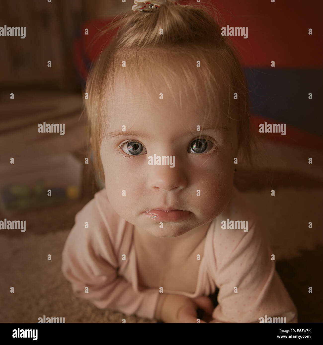 Emotions of a little girl with Down syndrome Stock Photo