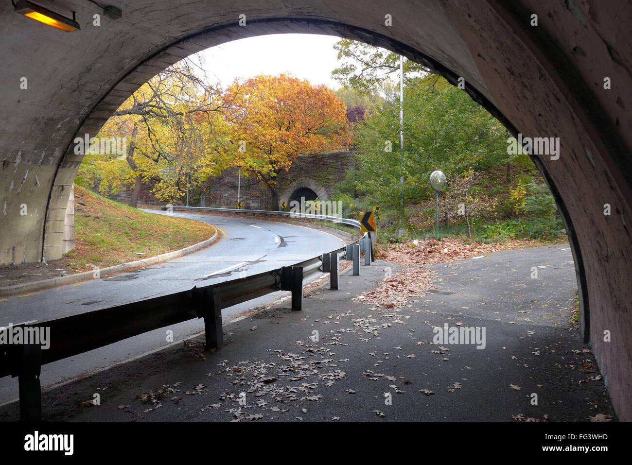 Fall in New York City , a road  and pathway under the West Side Highway in Riverside Park Stock Photo