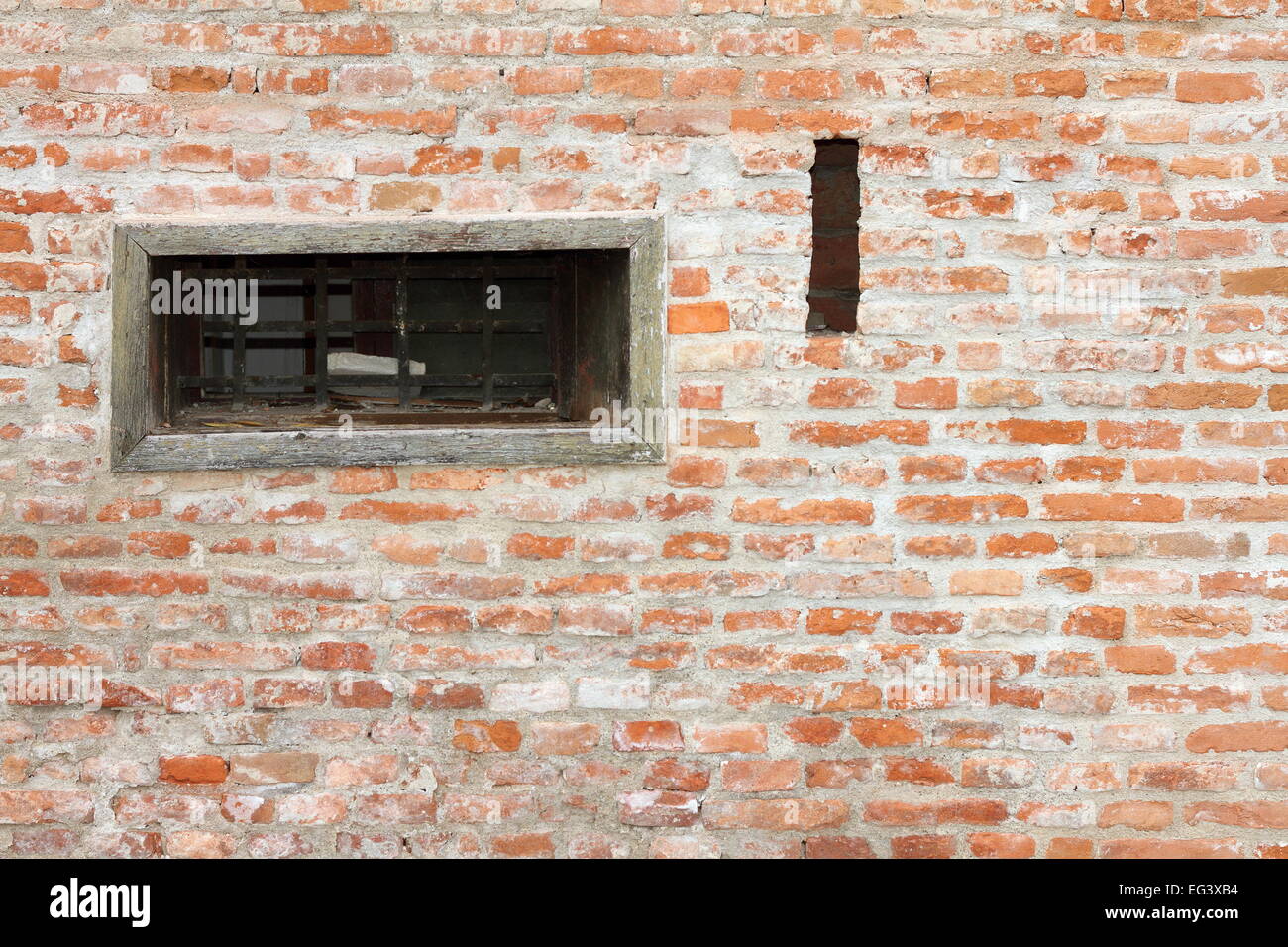 textured wall of old house with a window Stock Photo