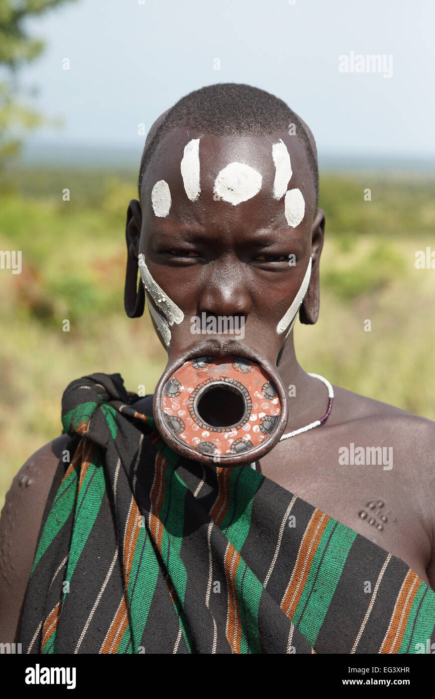 JINKA, ETHIOPIA - NOVEMBER 21, 2014: Mursi woman with traditional lip