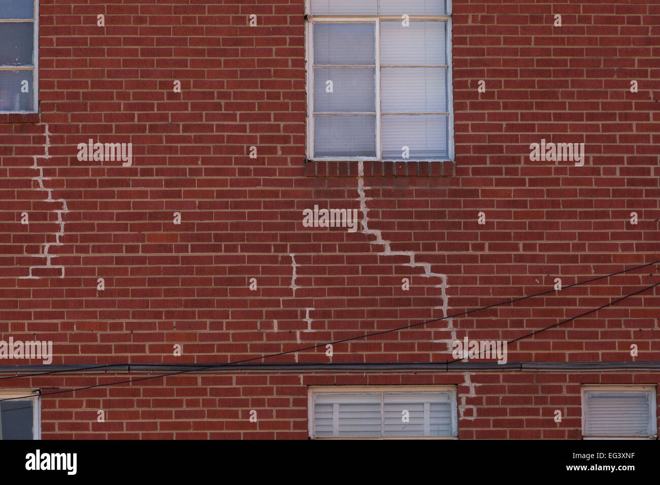 Visible crack repairs on brick exterior of building - USA Stock Photo