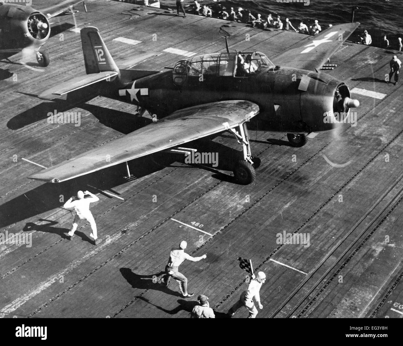 US NAVY GRUMMAN TBF AVENGER of Torpedo Squadron VT-8 about to launch from USS Bunker Hill for a rocket strike against Saipan island in the Marianas in June 1944. Photo US Navy Stock Photo