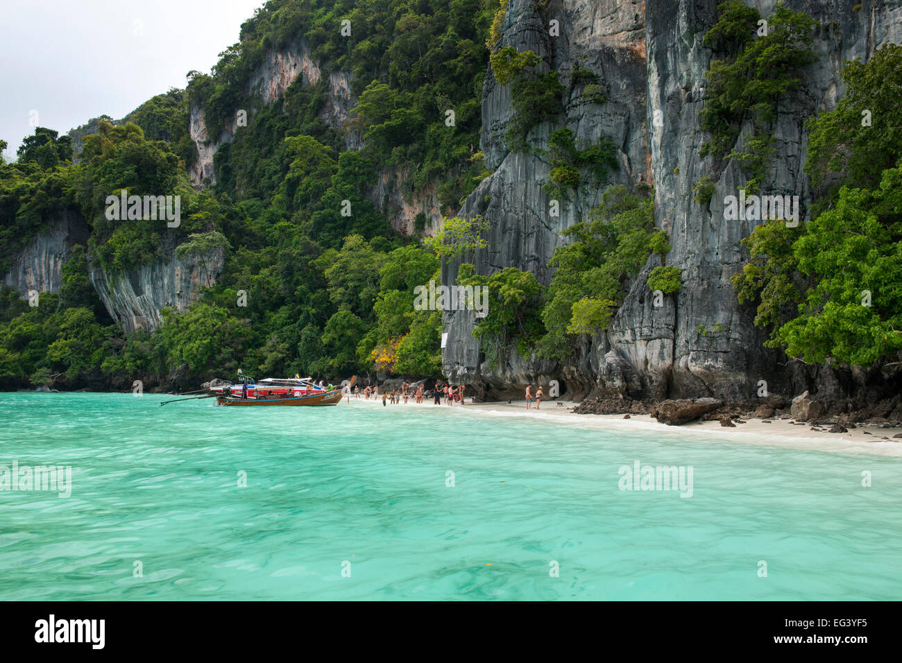 Tourist boats and the coast of Koh Phi Phi island in Thailand. Stock Photo