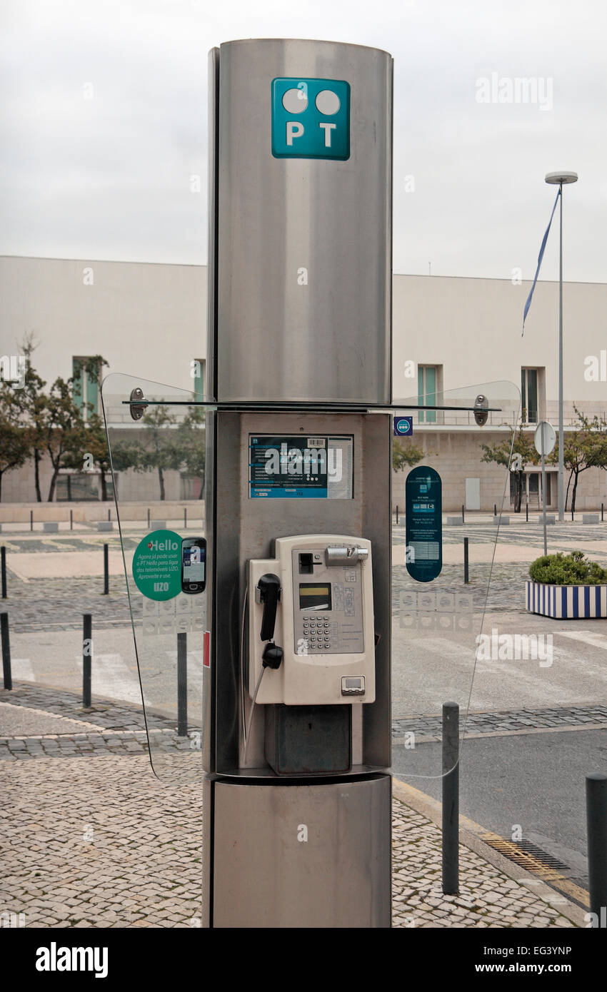 A broken PT (Portugal Telecom SGPS SA) public telephone in Parque das Nacoes, Lisbon, Portugal. Stock Photo