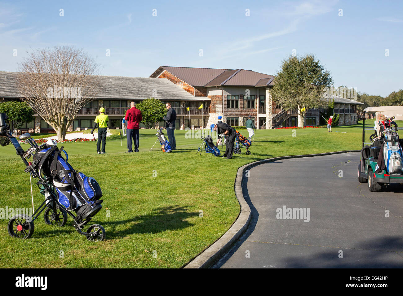 Golfers  on the putting practice area outside the Bay Hill hotel of Bay Hill Golf Club, Orlando, Florida, America. Stock Photo