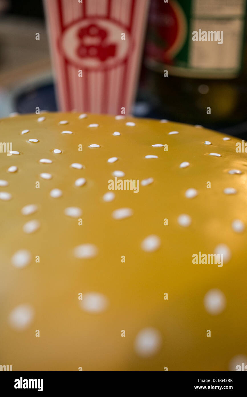 Close up of sesame seeds on a plastic hamburger bun Stock Photo