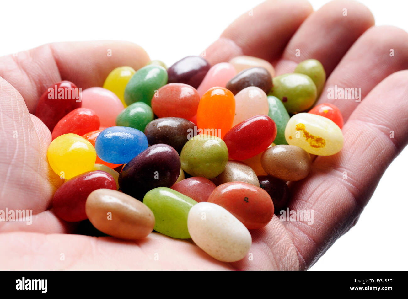 fruit jelly beans on hand, on white background Stock Photo Alamy