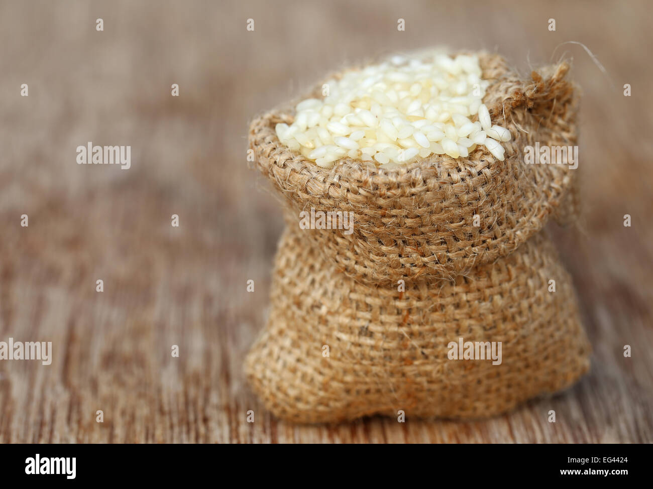 Fresh rice in sack bag Stock Photo