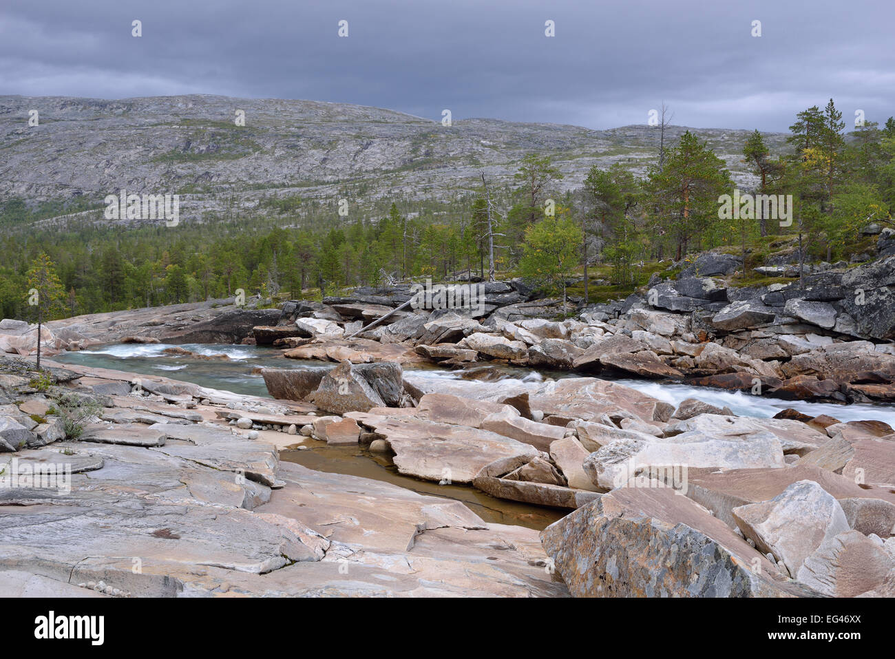 RMuonosjåhkå mountain river in SaRMtdaRM, near the Arctic CircRMe, Norway Stock Photo