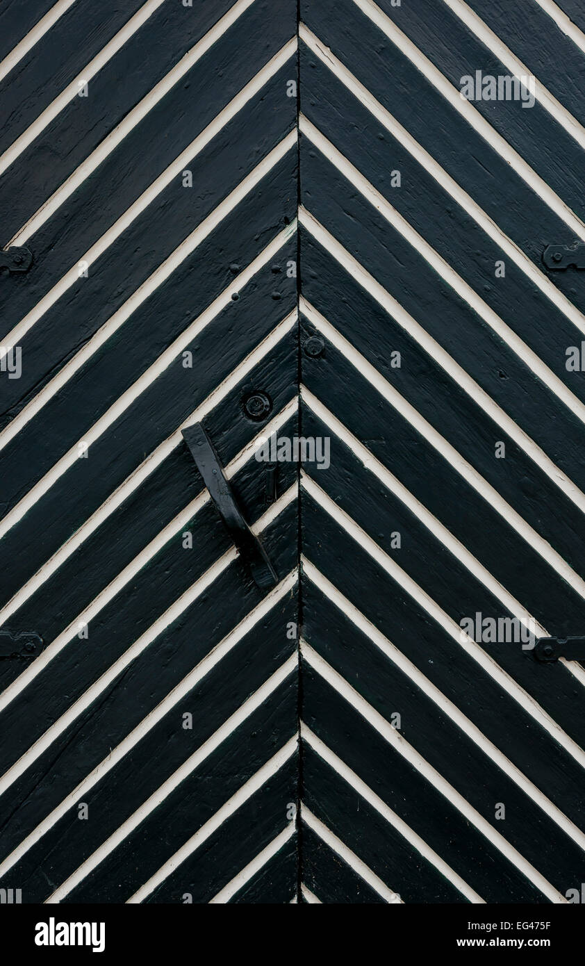 White and black door with fish bone pattern. Stock Photo