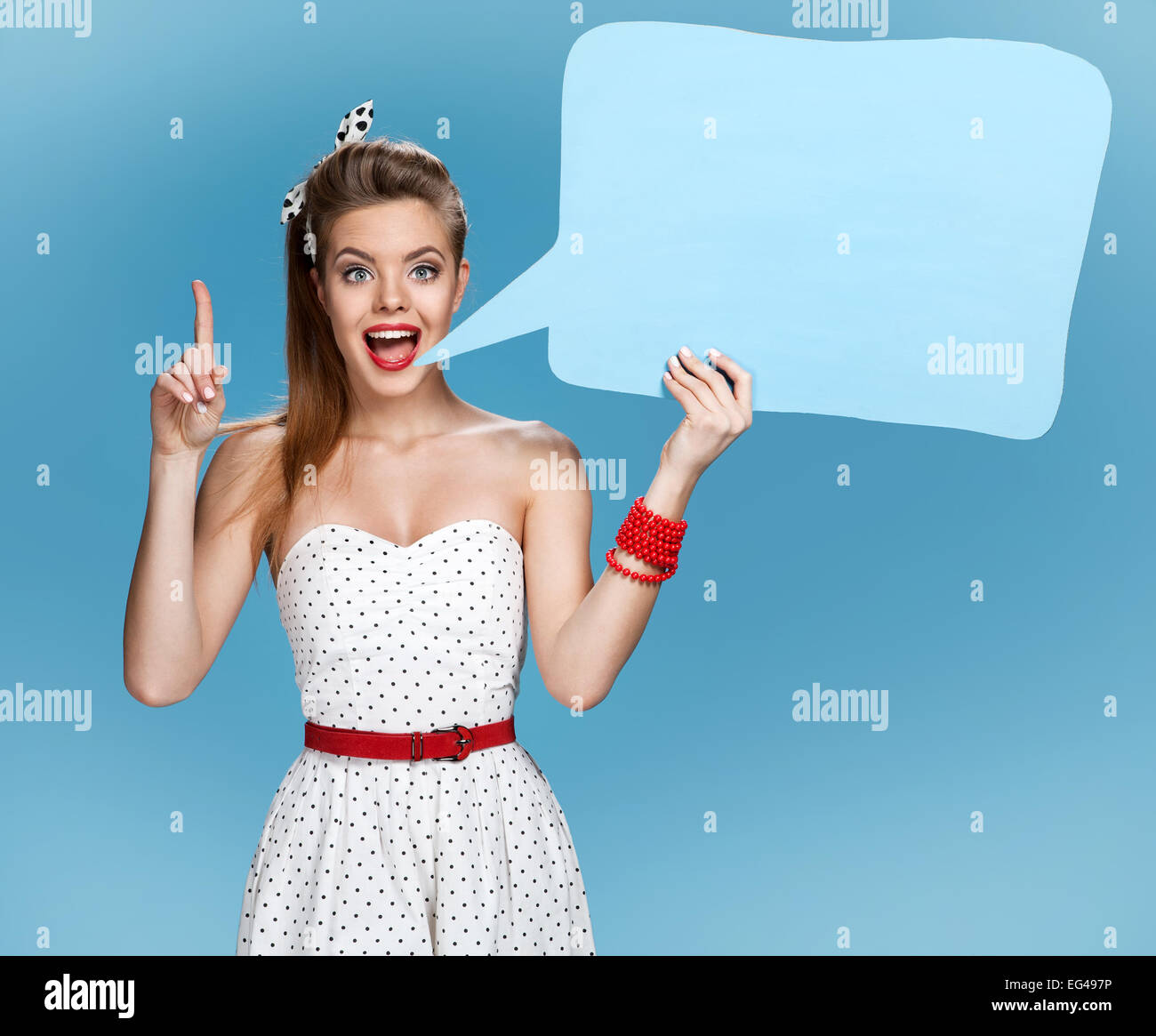 Conversable beautiful woman showing sign speech bubble banner looking happy excited Stock Photo