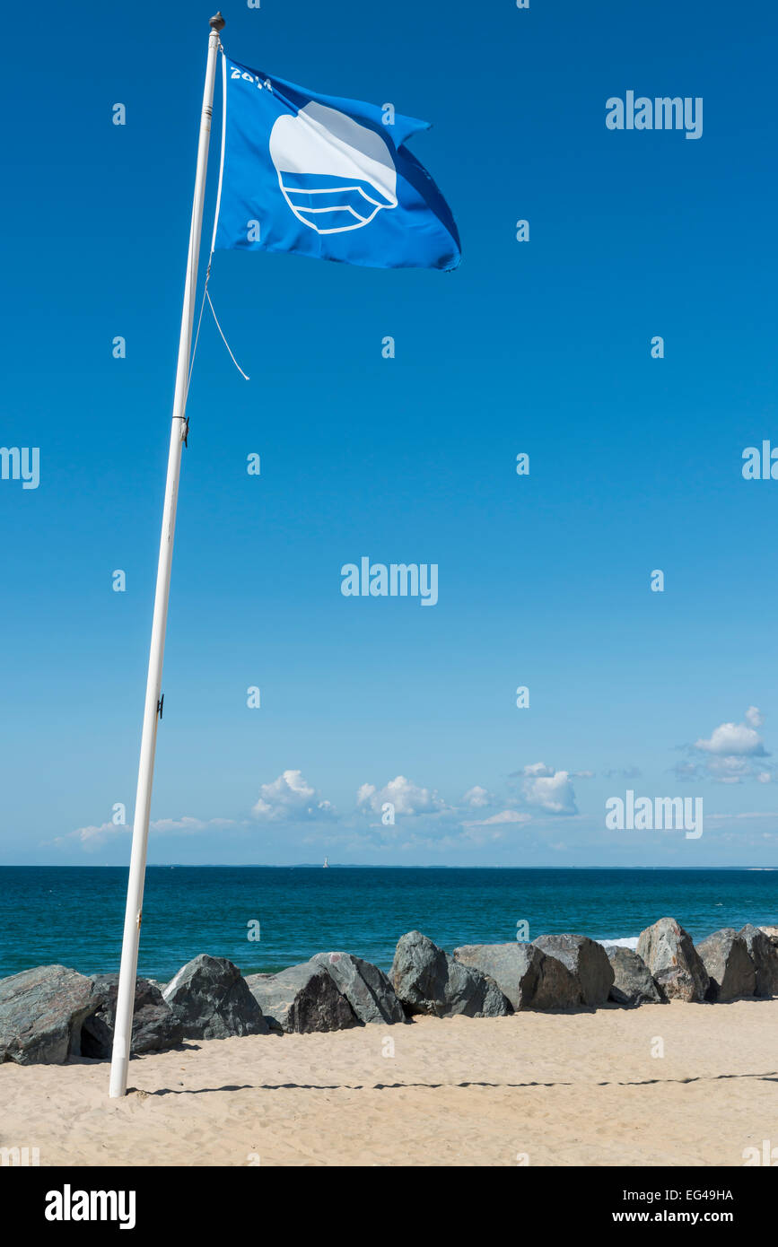 Blue Flag at the beach with blue sky. Flag for clean and sfe swimming. Stock Photo