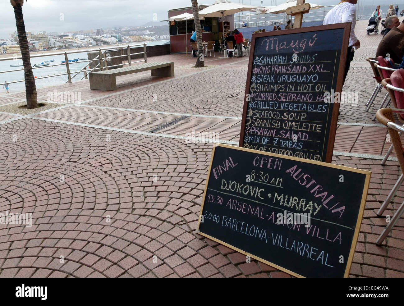 Board announcing British sports fixtures outside restaurant in Canary Islands, Spain Stock Photo