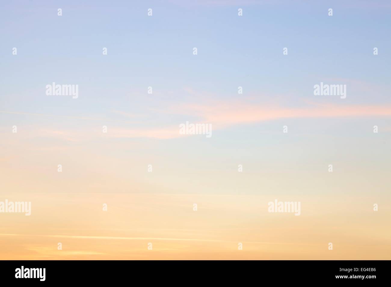 Sky with yellow and pink Cirrostratus cloud. Stock Photo