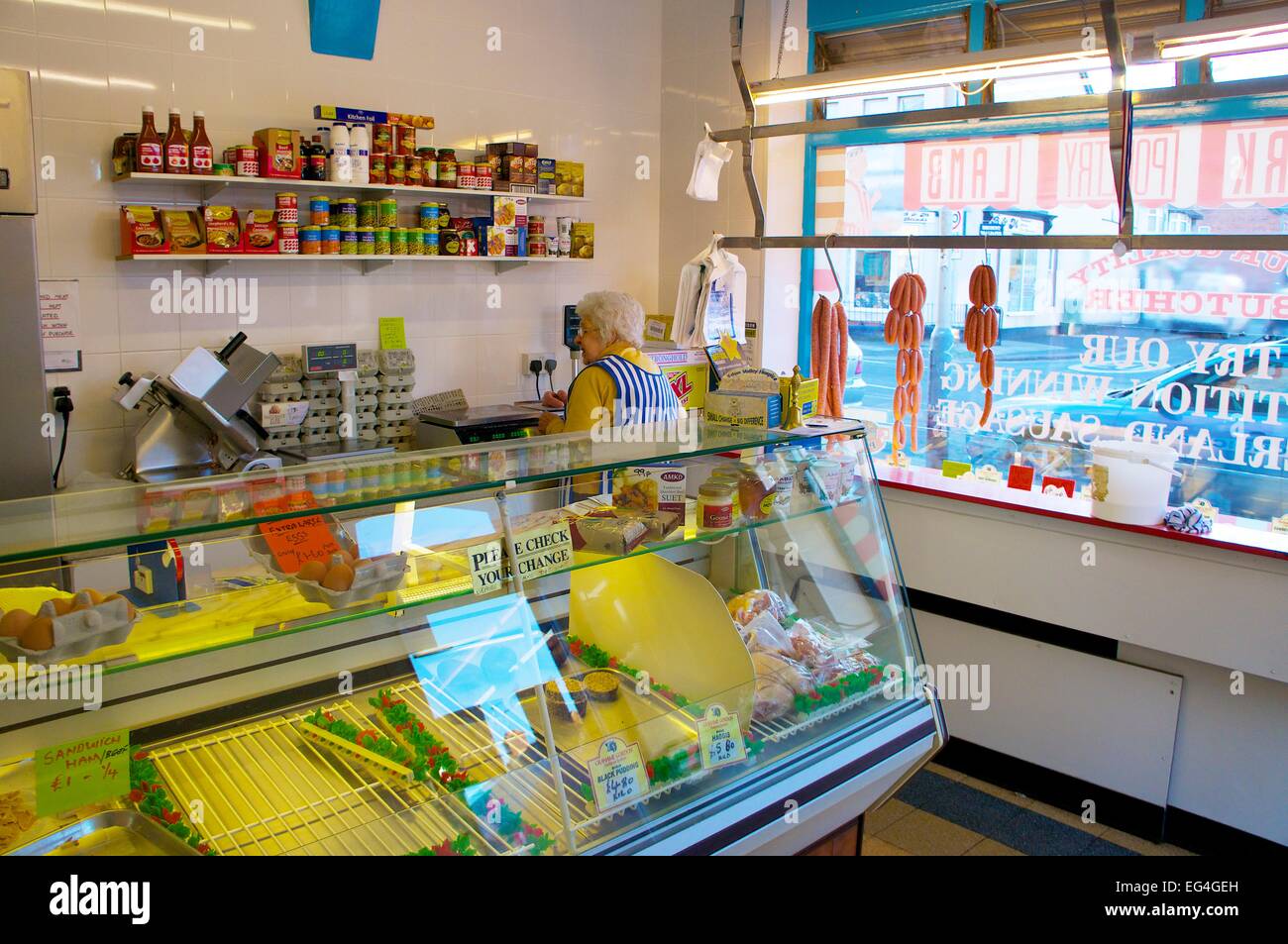 Traditional butchers shop refrigerated counter. Stock Photo