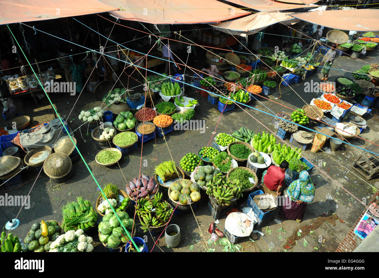 Bangladeshi vegetables vendors waiting for customers in Dhaka, Bangladesh. Stock Photo