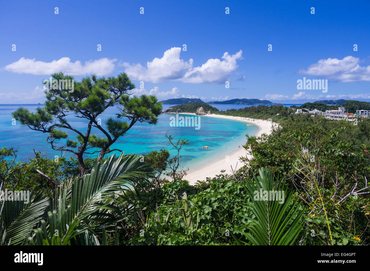 Beautiful Aharen Beach with tourists enjoying the sun and water on Tokashiki Island with Zamami Island behind, Okinawa, Japan Stock Photo