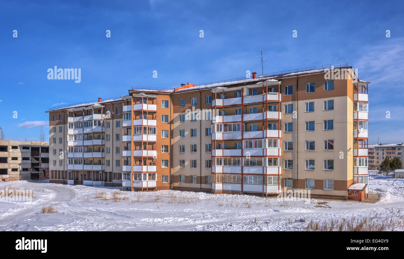 A sixstory apartment building in the Siberian city of winter Stock